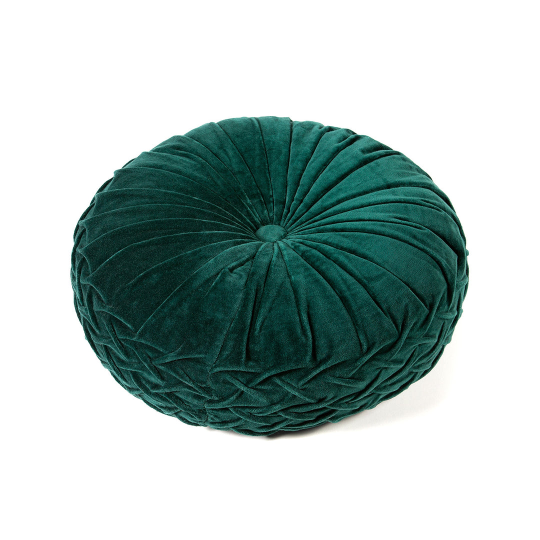 Forest green velvet round pintuck pillow on a white background.