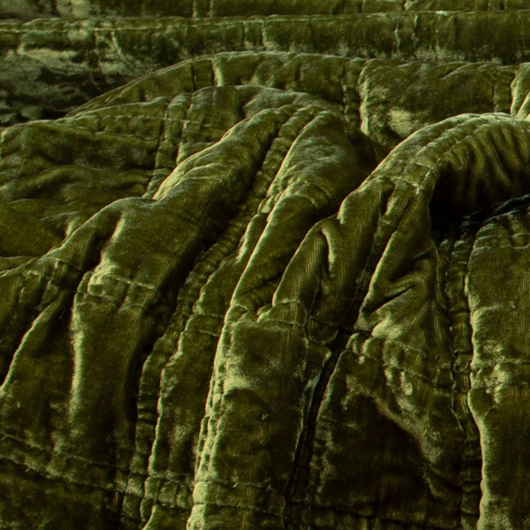 Moss green crushed velvet ruffle throw pillow with ruffled edges. 