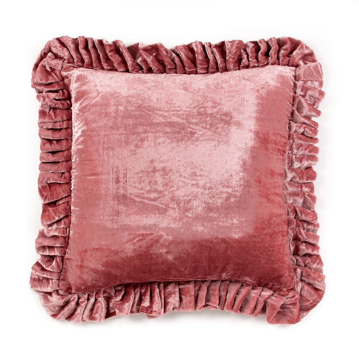 Pink velvet pillow with ruffled edges on a white background